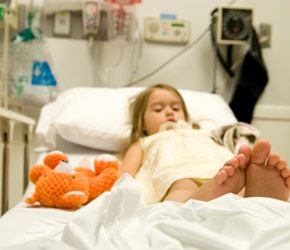 child in a hospital bed